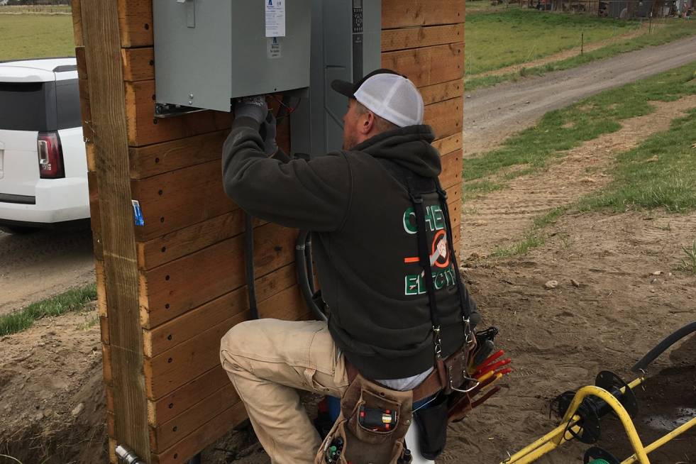 man fixing electrical cable